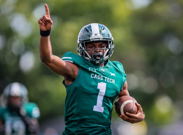 Sadler Jr. points before scoring a touchdown against Southfield A&T earlier this season. Photo by Mariusz Nowak.